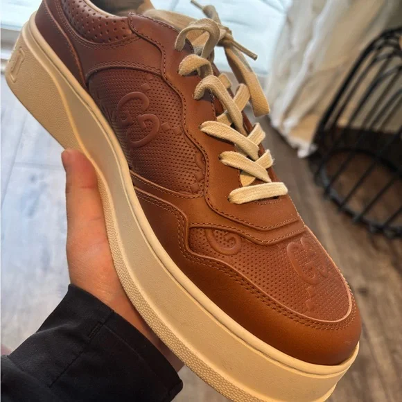 GG logo-embossed sneakers *Original* $700 - Picture 1 of 4